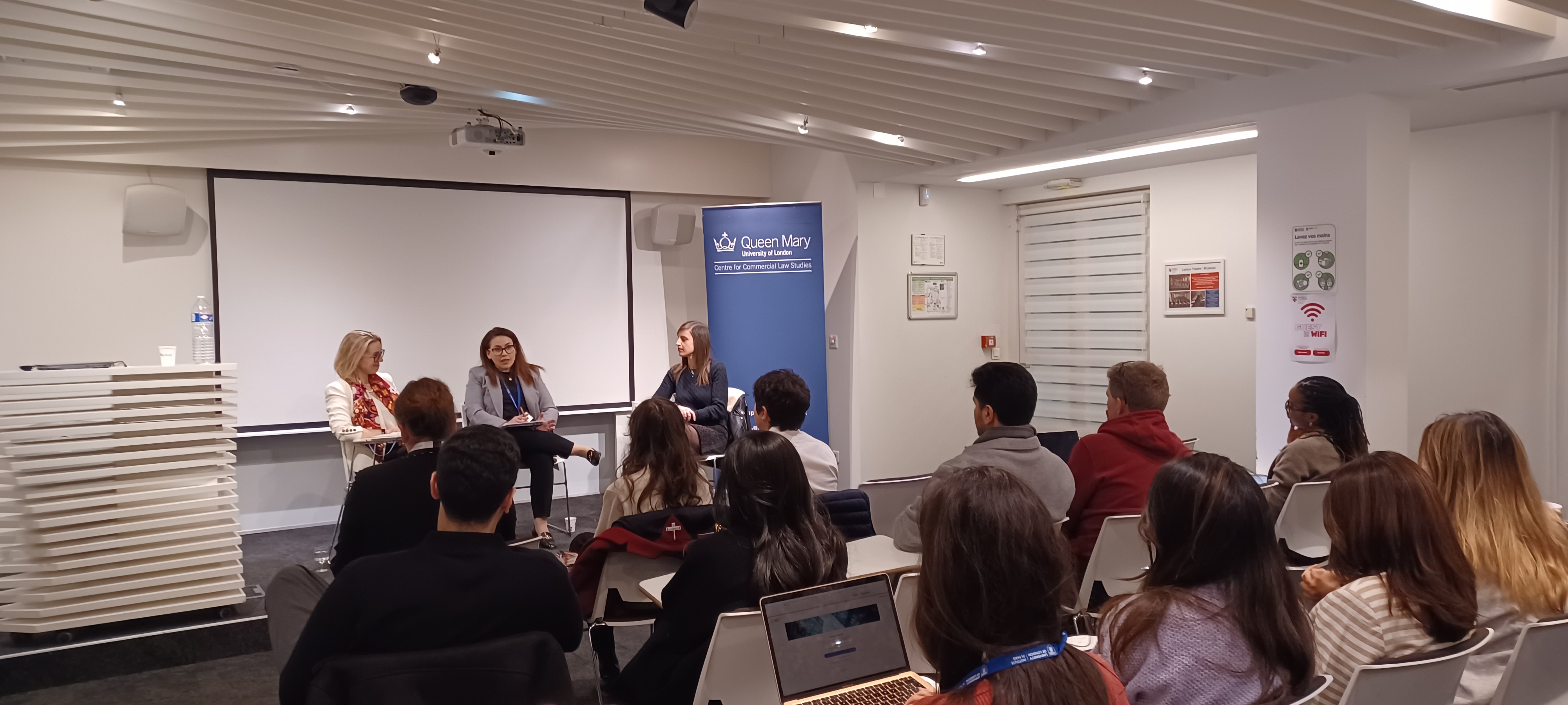 Panel speaking to a room of students