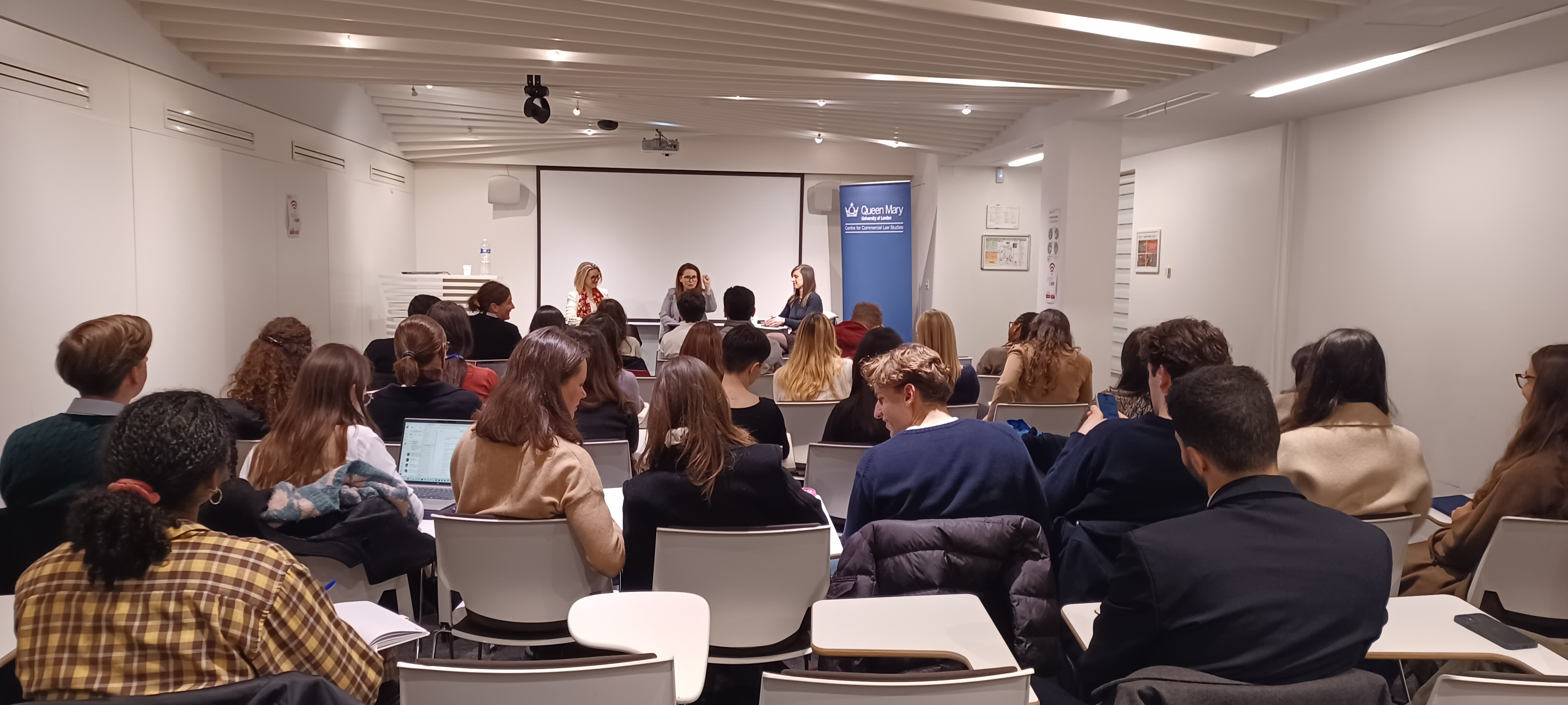 Panel speaking to a room of students