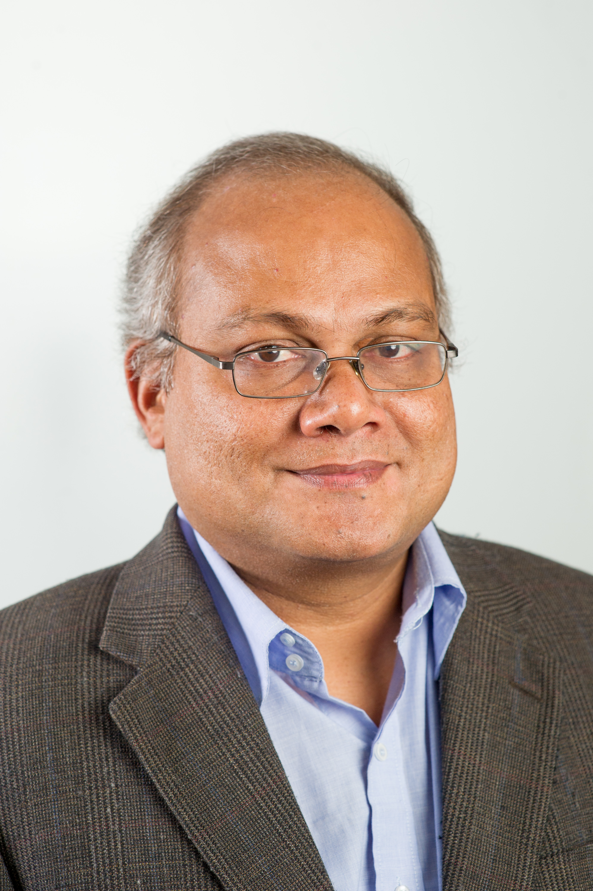 Professor Nallanathan looking at camera smiling