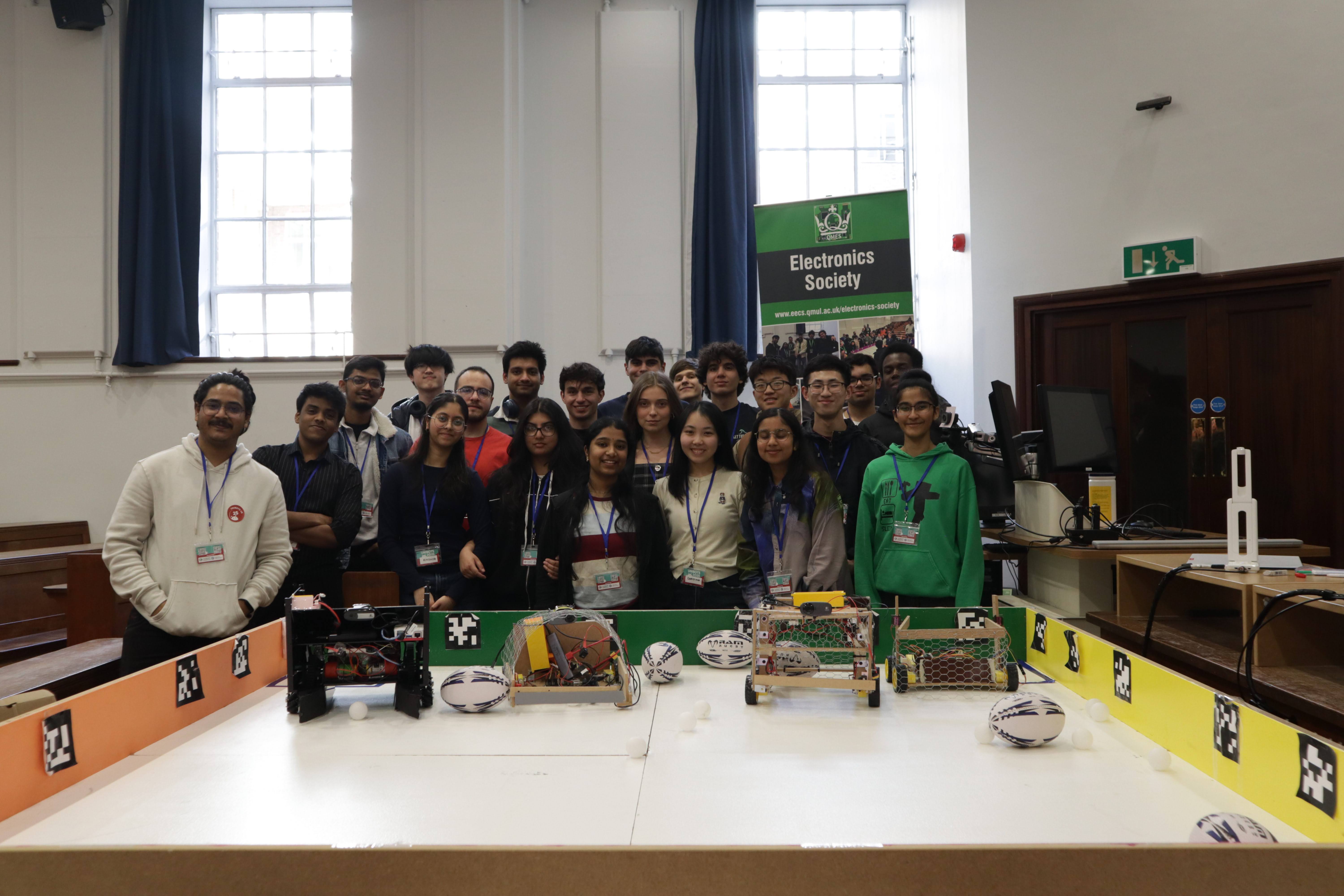 Group of students standing at robot competition