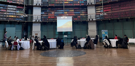 Participants sitting around tables