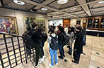 CCLS Students listening to a tour guide speak about Lloyd's of London, whilst getting a tour of their building.