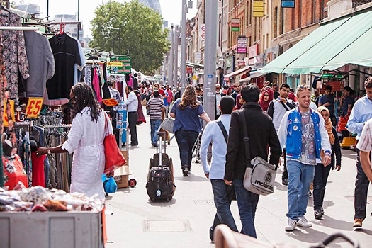 People shopping at market stalls in Whitechapel