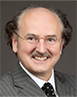 Photo of Professor Peter Cameron smiling and wearing a grey suit