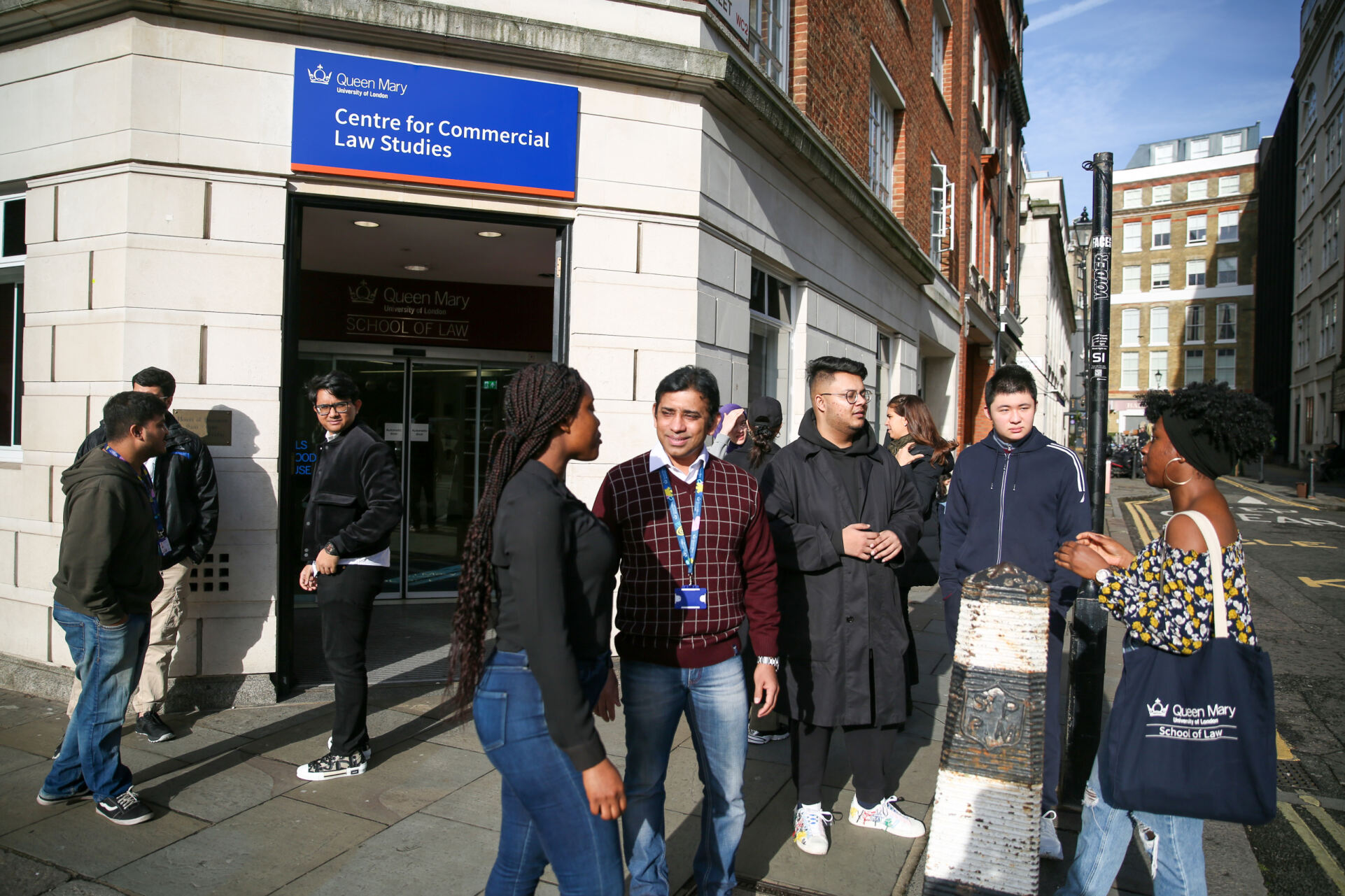 LLM students standing outside the Centre for Commercial Law Studies building in Holborn, London.