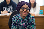 Queen Mary law student sat in a lecture