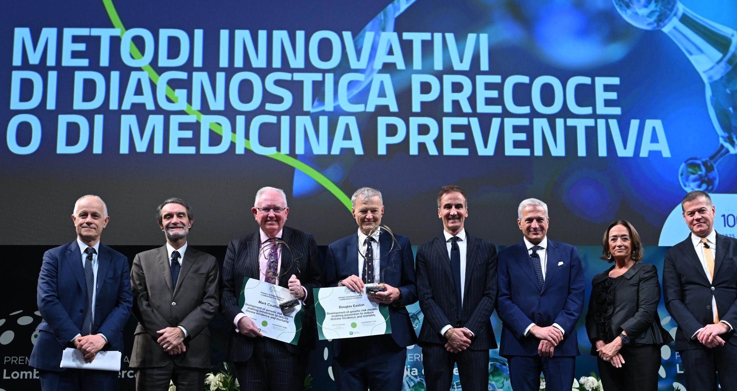 Professor Sir Mark Caulfield and others on stage for Lombardy 2025 prize