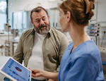 Female doctor consulting with overweight patient