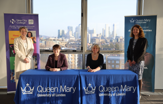 Two people signing MoU between Queen Mary and New City College