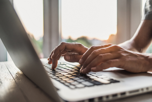 Person typing on laptop computer keyboard.Credit:Poike/iStock.com
