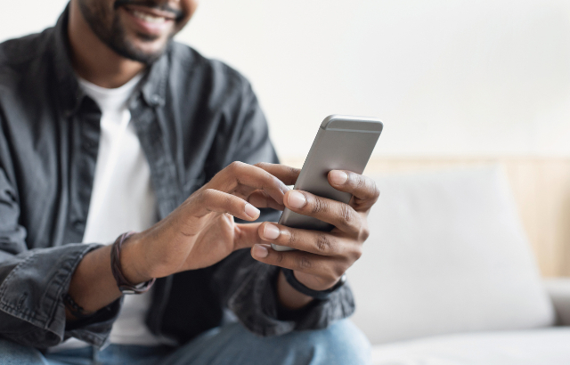 Man on smart phone. Credit: iStock.com