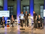 Dr Oussama Metatla accepting the award presented by the President of AT&T New York at the ADA 25th anniversary celebration event