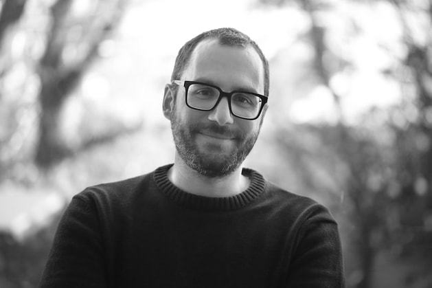 Black and white headshot of Kostas Papafitsoros