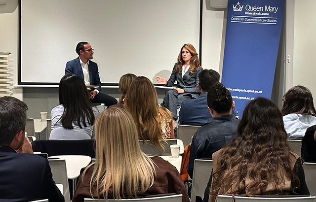Achilleaus Pitsavas and Flavia Silvestroni sat at the front of a seminar room of students having a discussion.