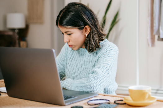 Female student on laptop working from home
