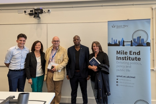 Politics staff next to Mile End Institute banner
