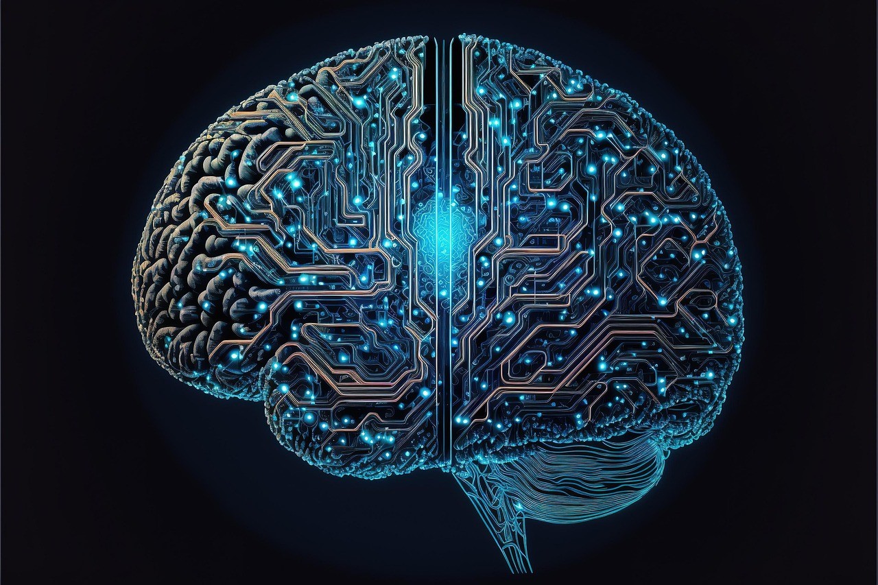 A blue, circuit-like electronic brain with a glowing light at its center, set against a black background.