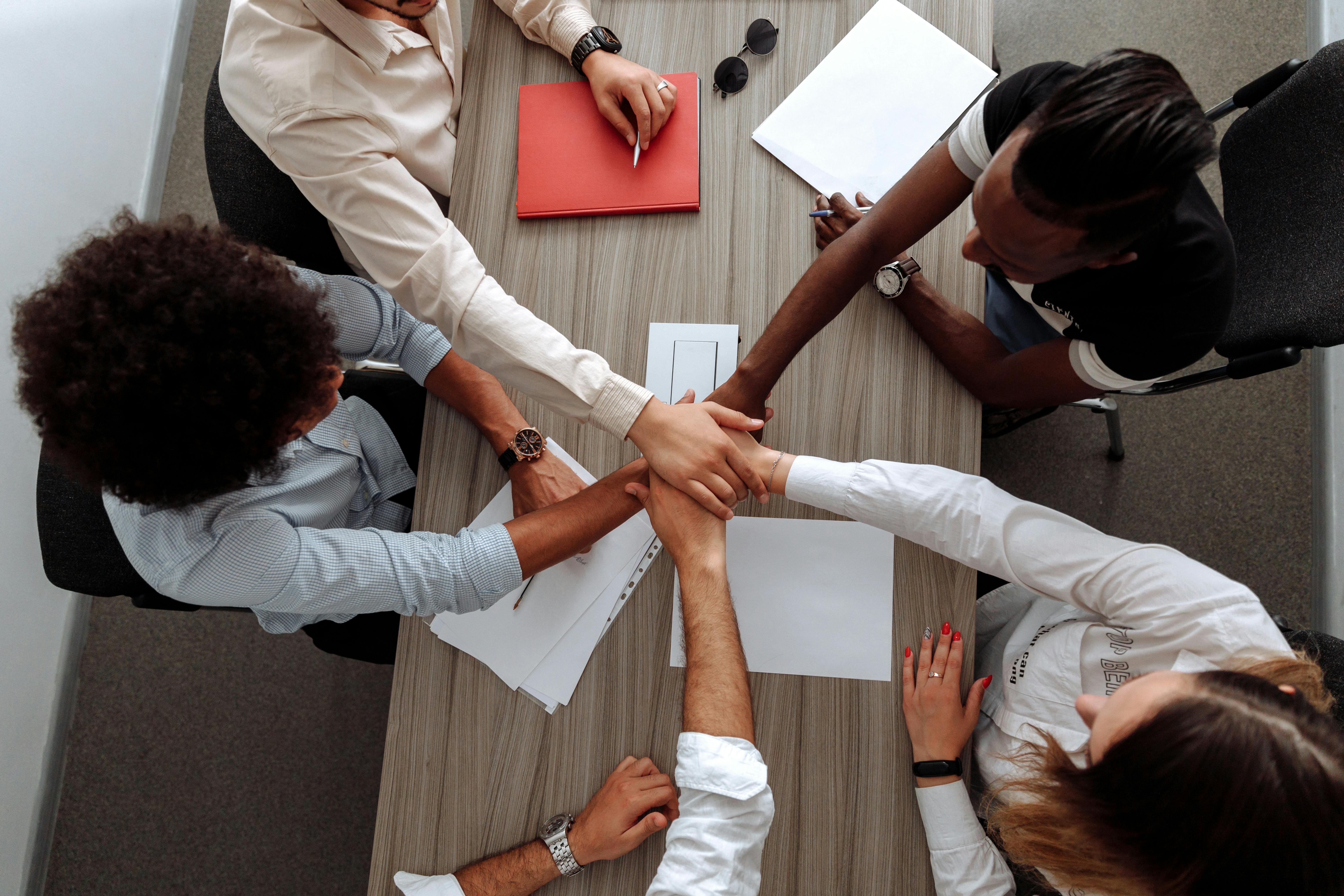 A group of people creating a team hand-stack