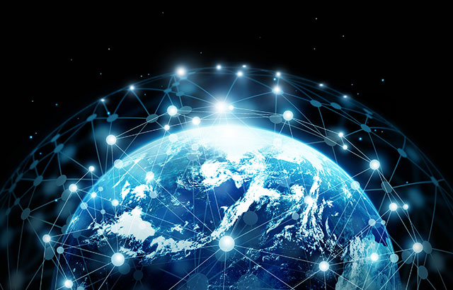 An image of the globe with lots of connected dots hovering over the surface.